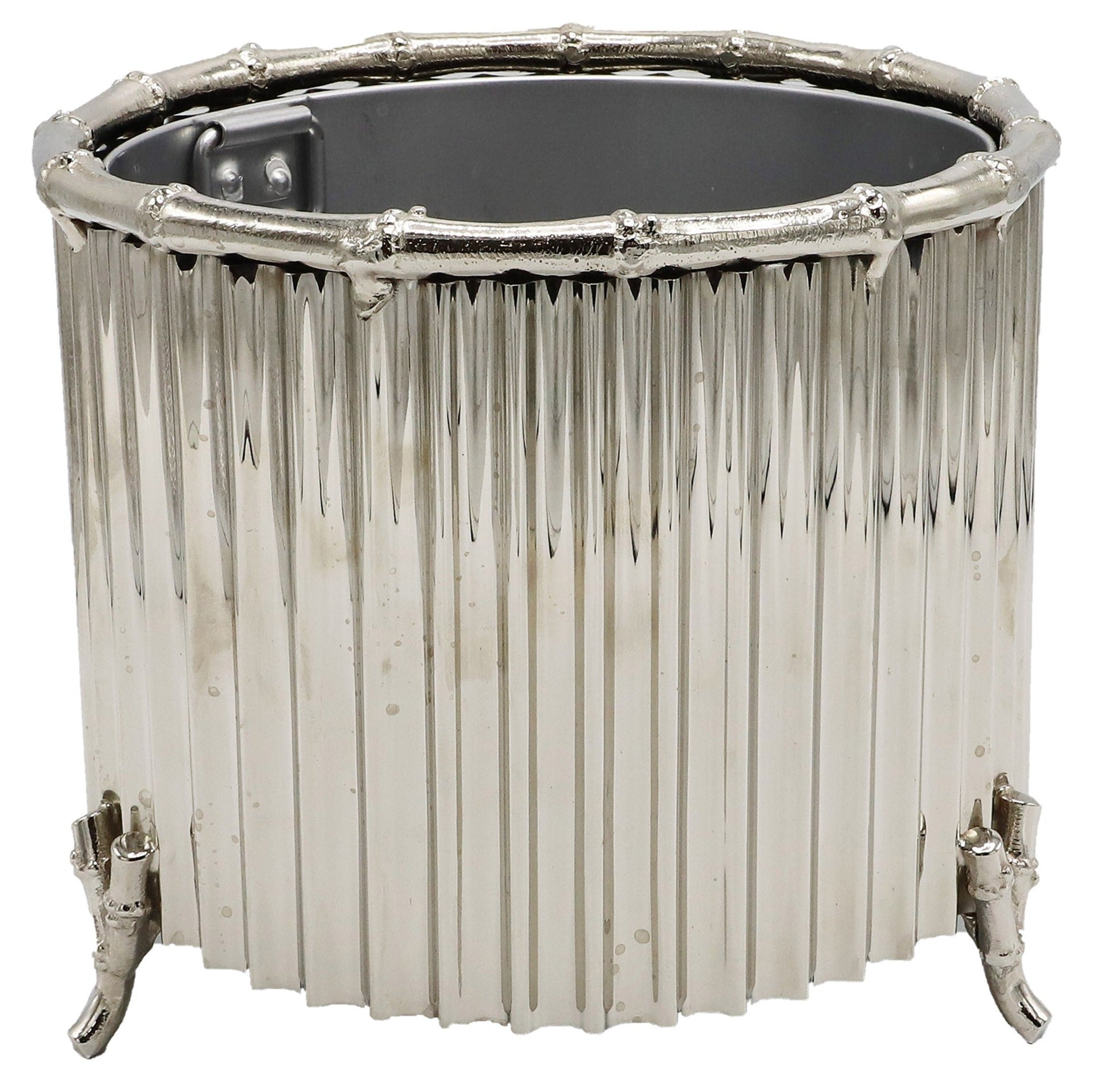 The Small Nickel Corrugated Bamboo Cachepot by Global Views is a handmade, metallic cylindrical piece with vertical ridges, bamboo-inspired edges, and four petite feet.