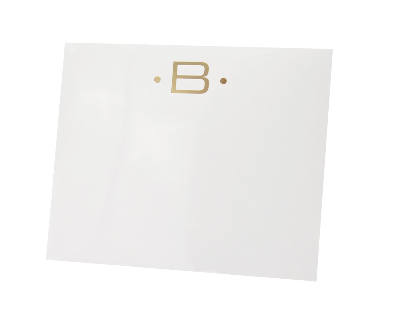 The Gold Initial Large Notepad by Black Ink features a white square card made from heavyweight paper, with a gold letter "B" centered between two small gold dots near the top.