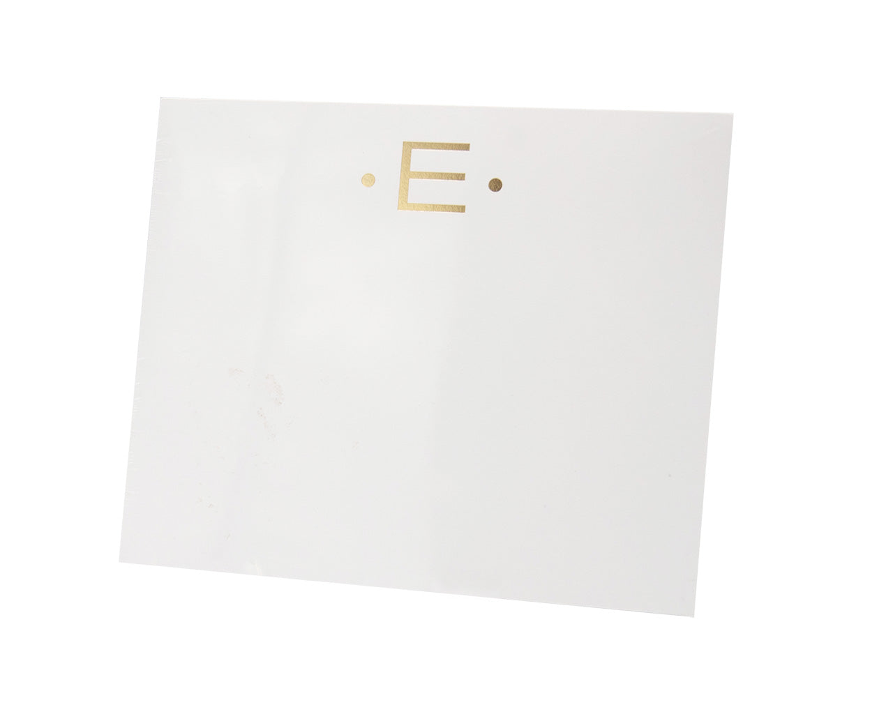 The Black Ink Gold Initial Large Notepad features a white square design made from heavyweight paper, with a gold letter “E” between two gold dots, shown on a white background.