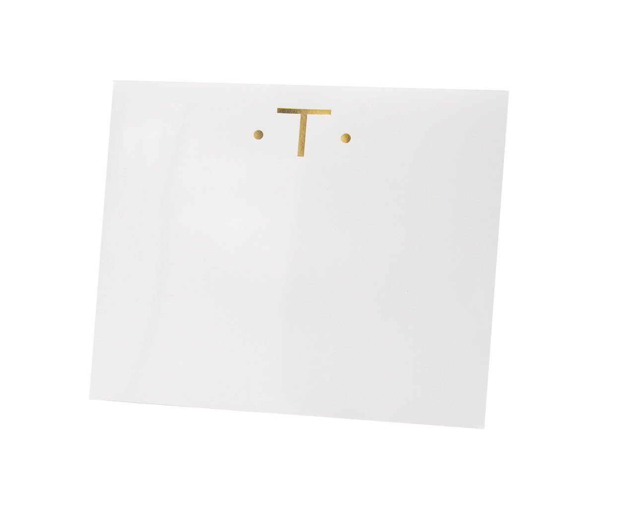 The Black Ink Gold Initial Large Notepad features a gold capital "T" centered between two gold dots on high-quality, heavyweight white paper with a velvety smooth finish.