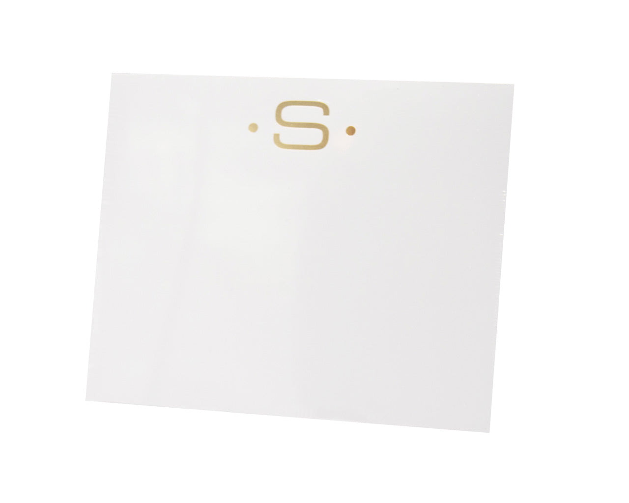The Black Ink Gold Initial Large Notepad is a white square pad made from heavyweight paper, featuring a gold letter "S" near the top with two small gold dots on each side.