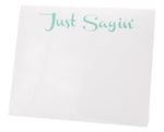 The Black Ink Just Sayin' Large Notepad features "Just Sayin'" in light green cursive atop quality white paper—ideal for jotting notes or displaying in a Lucite Notepad Holder.