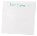 The Black Ink Just Sayin' Small Paddie features "Just Sayin’" in light blue-green atop a white, high-quality paper napkin—ideal for display in a Lucite Notepad Holder.