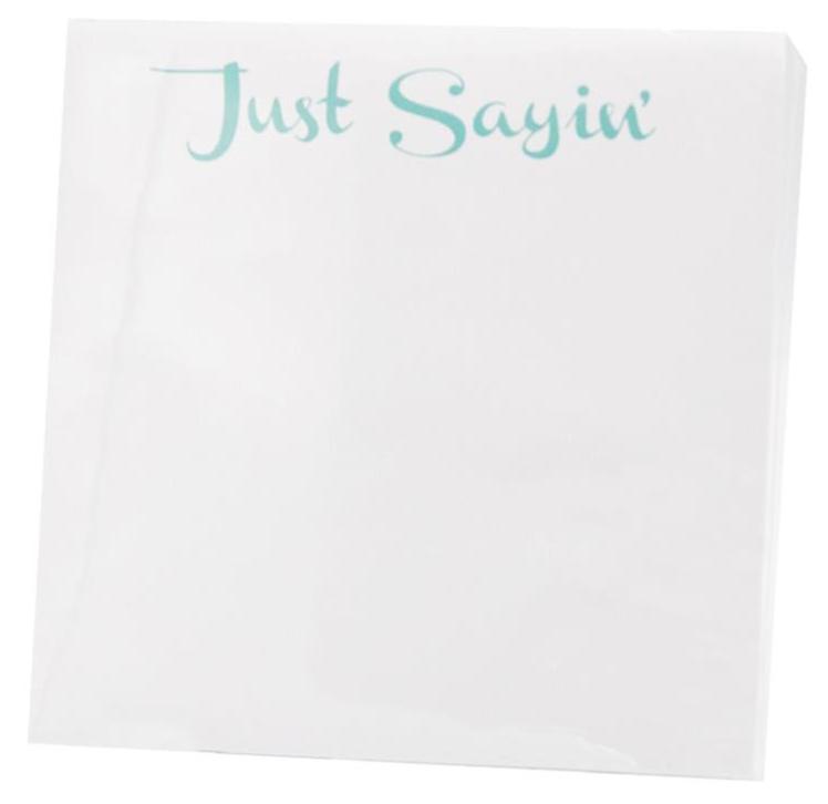 The Black Ink Just Sayin' Small Paddie features "Just Sayin’" in light blue-green atop a white, high-quality paper napkin—ideal for display in a Lucite Notepad Holder.