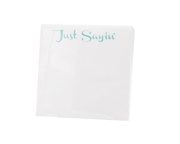 Black Ink Small Paddie - Just Sayin notepad with the phrase "just sayin'" printed at the top in light blue cursive script, housed in a Lucite notepad holder.