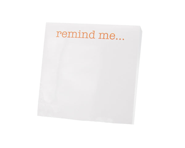 A Black Ink Small Paddie - Remind Me notepad with the words 'remind me' on it, encased in a Lucite Notepad Holder.