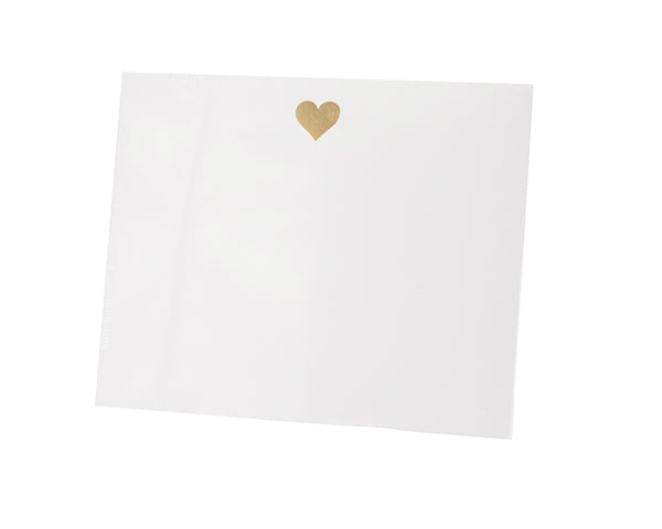 A luxurious Black Ink Heart Large Notepad adorned with a radiant gold heart, resembling a gold foil design.