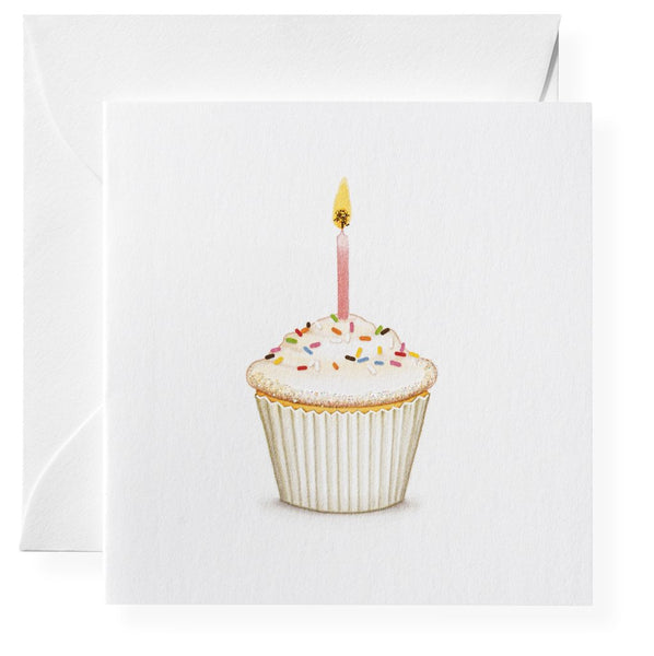 A Karen Adams gift enclosure featuring an illustration of a cupcake with a lit candle, designed as a hand-glittered birthday card.