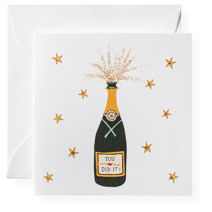 Celebrate with Karen Adams' Congratulations Gift Enclosures, featuring a champagne bottle popping and "You Did It!" surrounded by gold stars. Pair with hand-glittered cards for an extra-special message.