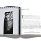 An open book from Assouline’s "The Impossible Collection of Cigars" showcases an introduction on the right and a black-and-white photo of a prestigious cigar on the left, part of an exclusive collection.