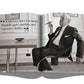 An elegant open book displays a black and white photo of a man in a suit with a cigar, featuring "The Impossible Collection of Cigars" by Assouline. The page highlights essentials like Dunhill cigars, martinis, and luxury clothing—an homage to the finest cigars crafted by renowned makers.