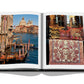 An open book, Italian Chic by Assouline, reveals a photograph of a canal in Venice on the left page and an image of patterned textiles and cushions on the right, capturing the timeless Italian style.