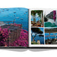 An open book displaying photographs of a coastal town, showcasing the hidden side streets and vibrant pink flowers, blue waters dotted with boats, outdoor dining scenes evoking timeless Italian style, and scenic landscapes. This exquisite visual journey is captured in "Italian Chic" by Assouline.