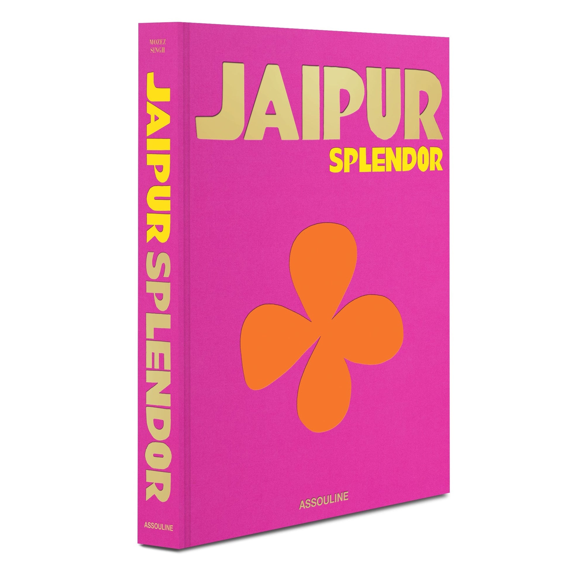 The image shows the cover of Jaipur Splendor by Assouline. The vibrant cover, paying homage to the Pink City, is bright pink with bold yellow text and an orange flower graphic, reminiscent of the Hawa Mahal's intricate beauty.
