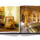 An open book showing images of a richly decorated interior with intricate designs and opulent furnishings, reminiscent of the Hawa Mahal in Jaipur, featuring ornate columns and a stunning painting that captures the essence of the Pink City: "Jaipur Splendor" by Assouline.