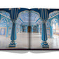 An open book displaying a page with an elaborately decorated hall reminiscent of Jaipur's architectural grandeur, featuring blue and white intricate designs, columns, and archways from the Jaipur Splendor by Assouline.