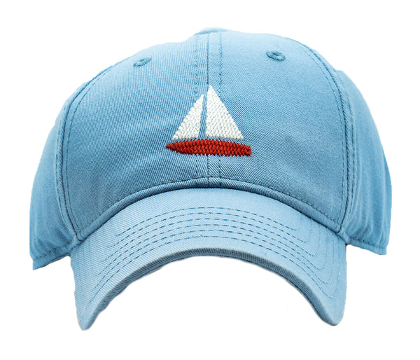 A Harding Lane blue hat with a sailboat design, featuring an adjustable strap for versatility.