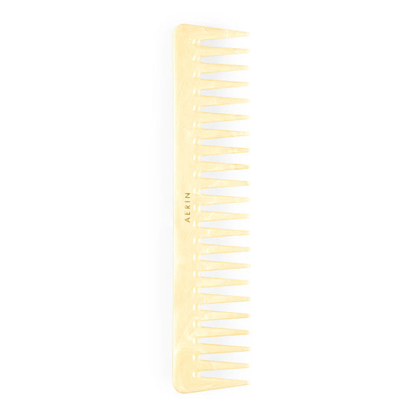 An Aerin large ivory comb with wide-toothed style on a white background.