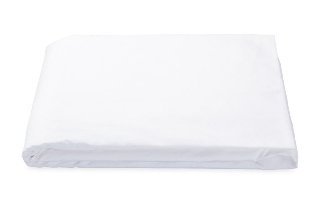 A Matouk Luca 17" Fitted Sheet in white, made from Egyptian cotton percale with a 500 thread count, is neatly folded on a plain background. This bedding essential is OEKO-TEX® Standard 100 certified for quality and safety.