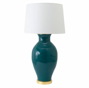The Paul Schneider Matagorda Glossy Mallard Lamp from Paul Schneider Ceramics features a teal ceramic base with a gold base, white cylindrical shade, and dimmer socket for adjustable lighting.