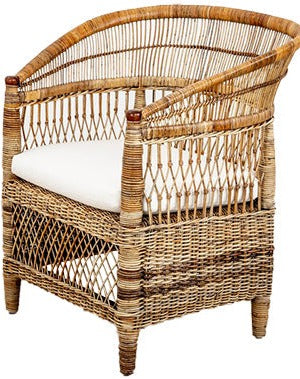 A hand-woven PALECEK Rattan Chair with a white seat cushion.
