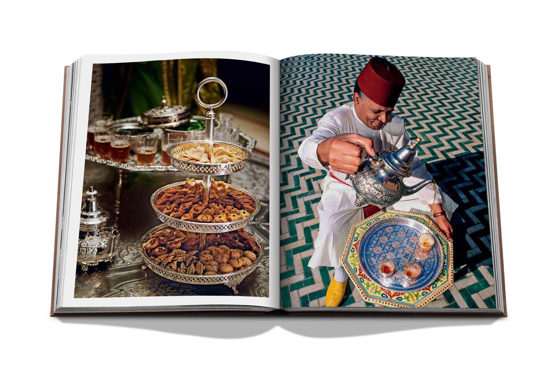 A person pouring tea beside traditional snacks, captured in a spread of a high-quality photo book celebrating Marrakech culture called Marrakech Flair by Assouline.