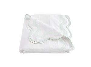 The Matouk Mirasol Bedding Collection in Opal features a folded white Egyptian cotton percale bedsheet with scalloped edges, a light green embroidered border, 600 thread count softness, and OEKO-TEX® certification.