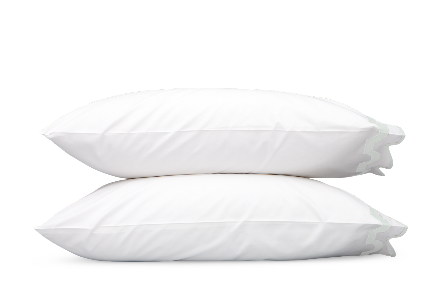 Two white pillows from the Matouk Mirasol Bedding Collection in Opal, stacked against a gray background, crafted from OEKO-TEX® certified Egyptian cotton percale for exceptional comfort.