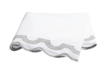 The Mirasol Bedding Collection in Silver by Matouk features a folded white bedsheet with a gray scalloped border, crafted from Egyptian cotton percale with a 600 thread count, displayed on a white background.
