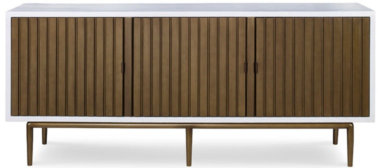 The Naples Cabinet by Mr Brown is a modern wooden sideboard with a smooth white gesso top, four vertically ribbed doors in aged brass, and slender legs.