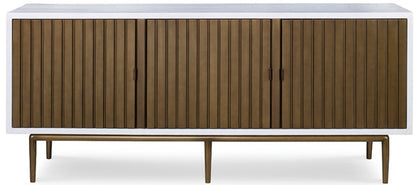 The Naples Cabinet by Mr Brown is a modern wooden sideboard with a smooth white gesso top, four vertically ribbed doors in aged brass, and slender legs.