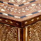 Close-up of the Bojay Large Octagon Side Table corner showcases intricate geometric and floral bone inlay patterns in contrasting light and dark tones.