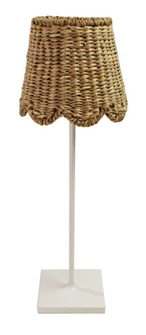 A wicker table lamp with a white base and Maison Maison x Zafferano Scalloped Seagrass Shade, Natural lampshade.