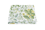 A folded Matouk Pomegranate Bedding Collection bedsheet with green and yellow botanical prints on a solid green background, OEKO-TEX Standard 100 certified.