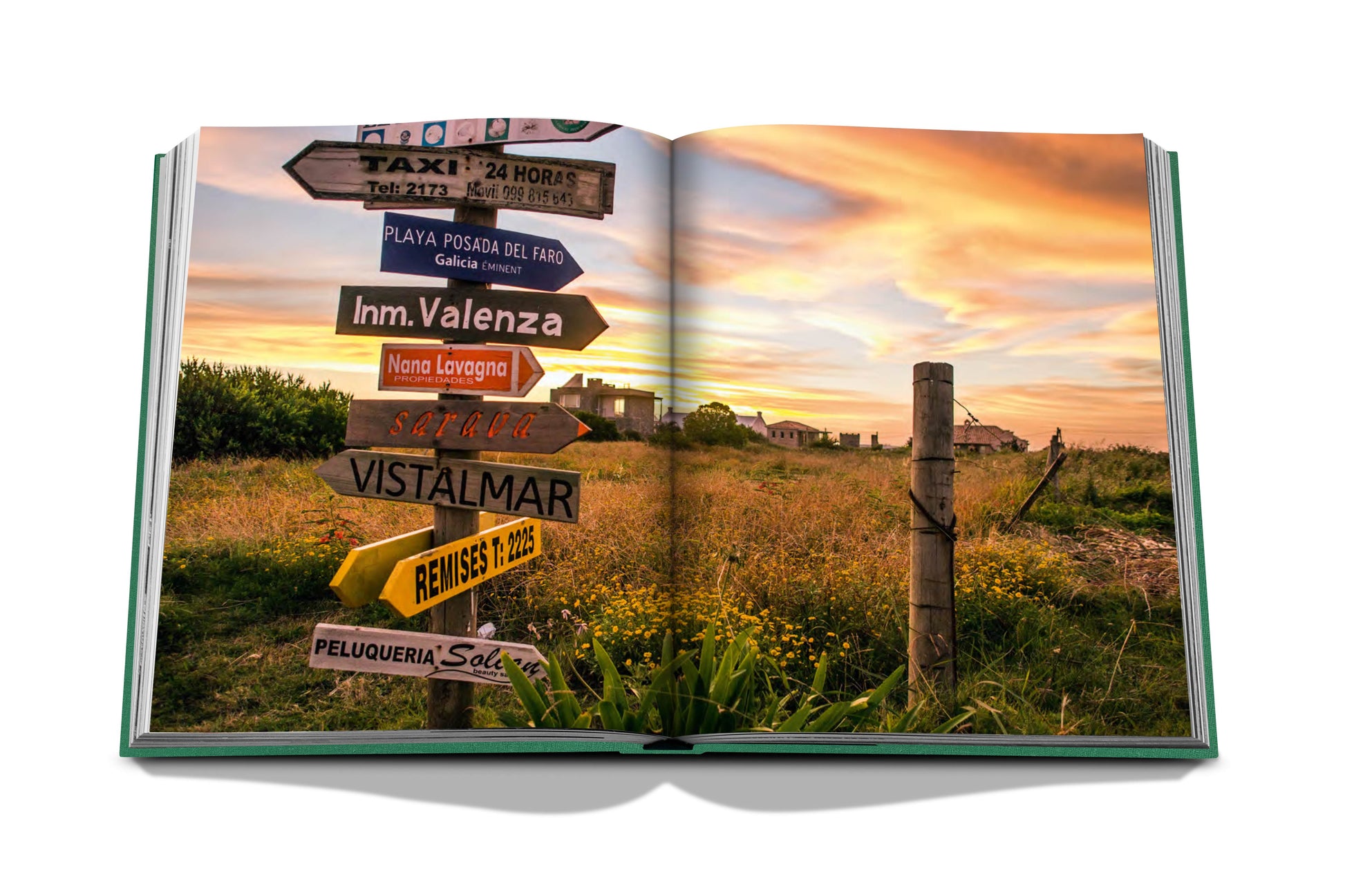 An open book with signs pointing to different places in Assouline's Punta Del Este.