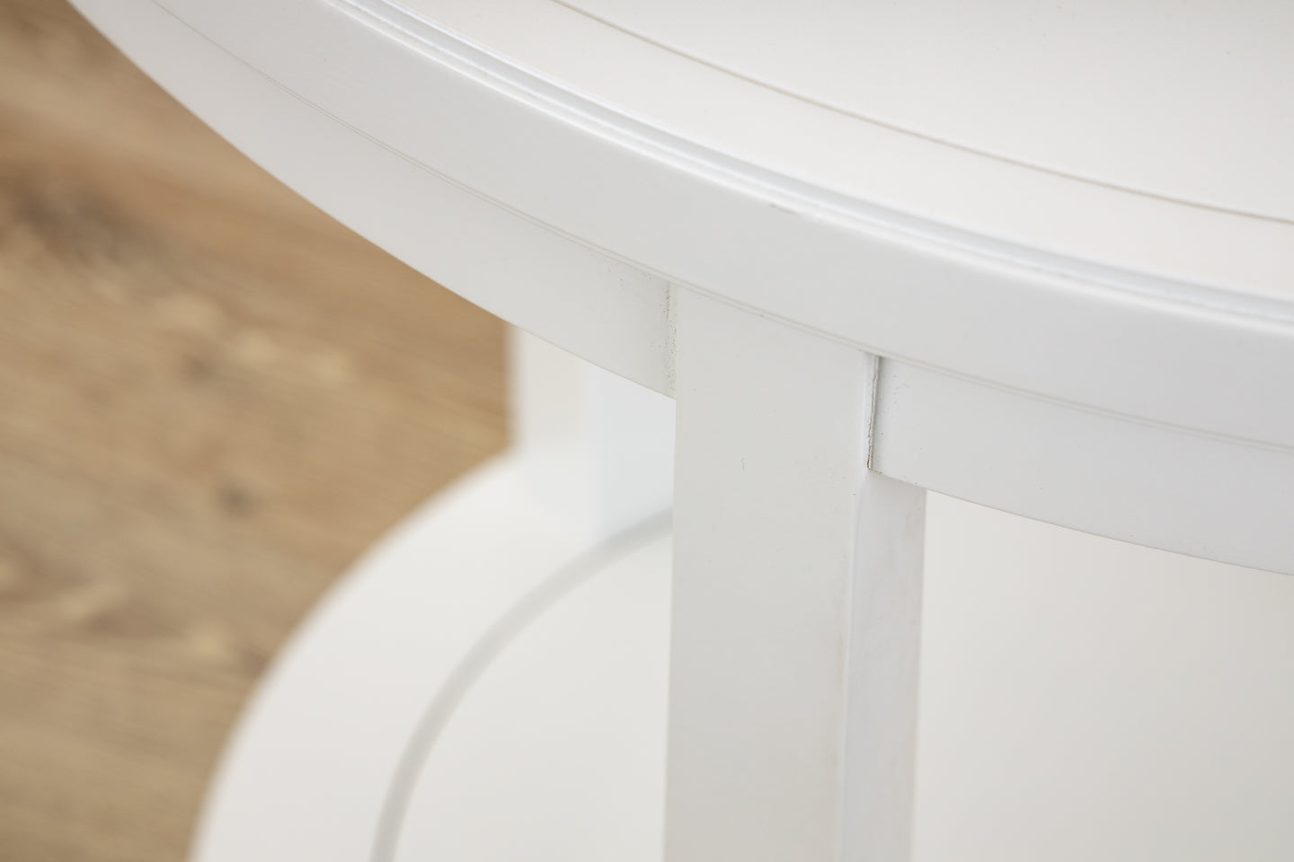 A Rye Round Side Table in White by Hickory Chair on a wooden floor.