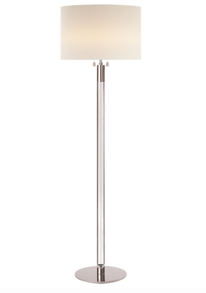 A Visual Comfort Riga Floor Lamp, Polished Nickel and Clear Glass with a white shade and clear glass.