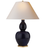 The Yue Double Gourd Table Lamp by Visual Comfort features a denim porcelain base, a white conical shade, and a gold-colored base. It's compatible with an E26 dimmer for adjustable lighting.