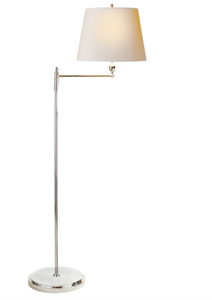 The Paulo Floor Lamp by Visual Comfort features a polished nickel stand, adjustable arm, and white shade. It uses a 150W bulb with E26 dimmer and stands on a circular base against a white background.