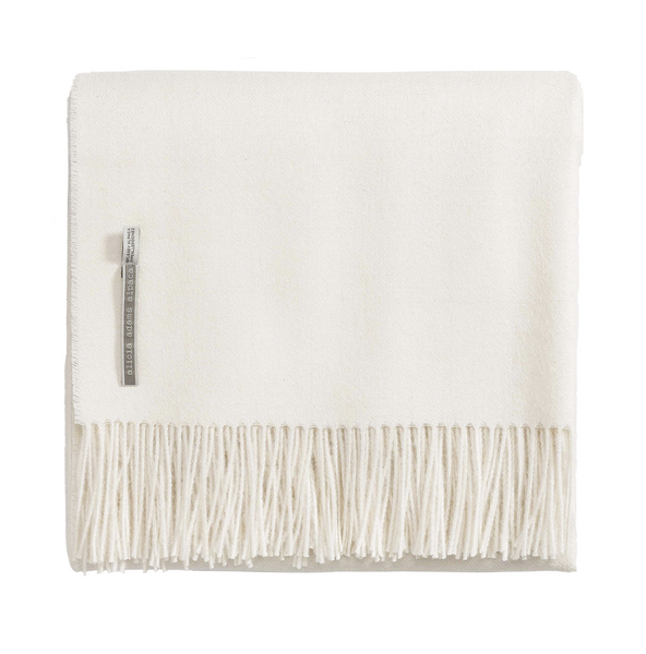 A Alicia Adams Alpaca Classic Throw, White blanket with fringes on it, perfect for anniversary gift ideas or a cozy addition to any space.