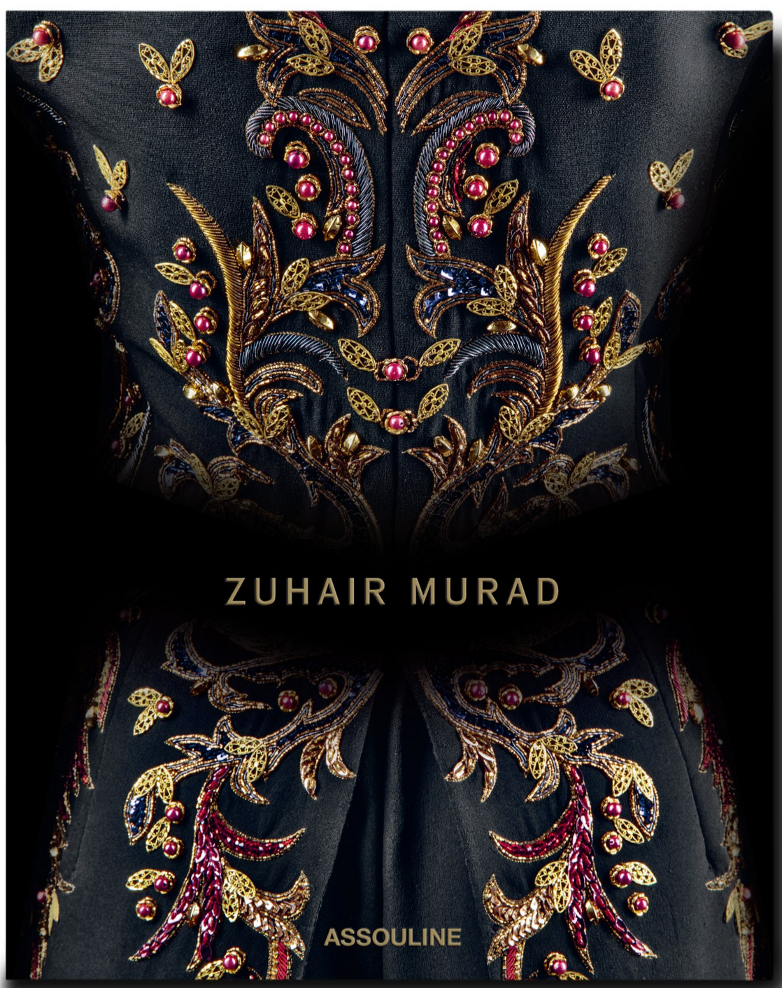 The Zuhair Murad fabric by Assouline showcases gold and red floral embroidery with exquisite handcrafted beading, featuring "ZUHAIR MURAD" at the center and "ASSOULINE" at the bottom.