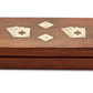A Two's Company wooden box with inlaid brass playing card suits design on its lid.