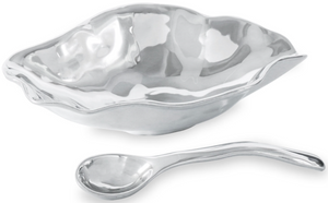 The Beatriz Ball Vento Claire Medium Bowl with Spoon features a wavy-edged, shell-inspired design and includes a matching curved metal spoon—ideal for serving in style at gatherings.