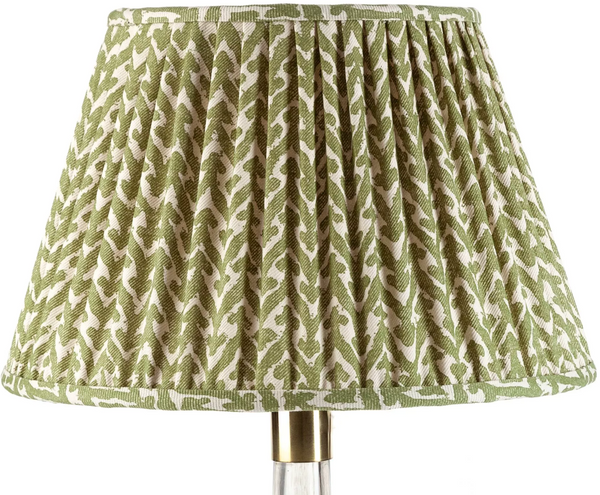 A Fermoie Rabanna Lamp Shade in Green and white, measuring 20" x 13", made of pleated linen and manufactured by John Rosselli.