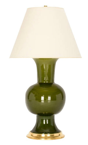 A Todd Lamp, Spruce by Christopher Spitzmiller with a brass cluster base and a white vellum shade.