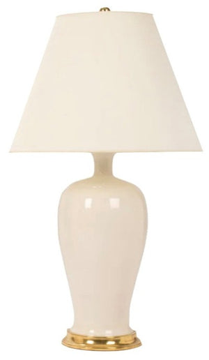 The Amy Lamp in Tea Stain with Gold Gilt by Christopher Spitzmiller features a white ceramic body, a brass cluster base, and a wide white vellum shade, shown against a plain background.