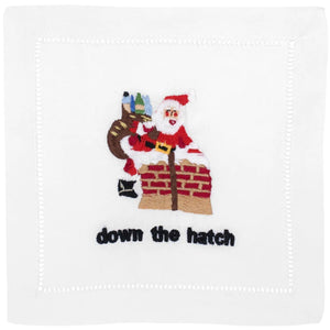 The August Morgan Down the Hatch Cocktail Napkins feature elegant cotton with Santa climbing into a chimney and “down the hatch” stitched below, finished with classic hemstitching.