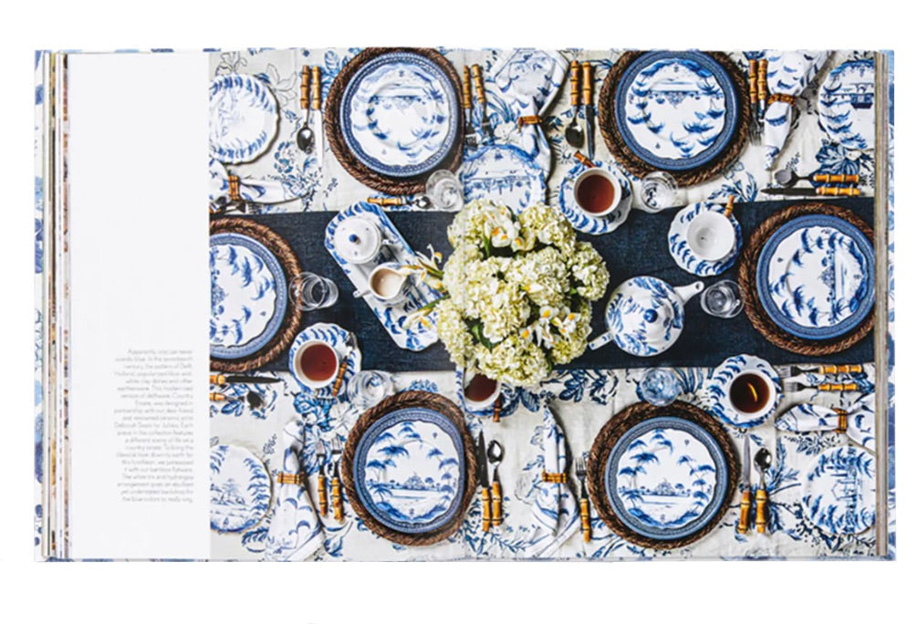 An elegant table arrangement featuring Juliska's Together at the Table collection, complemented by a floral centerpiece and tea cups, perfectly celebrates life's moments with dining elegance.