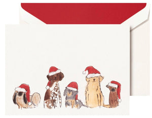 The Crane Santa Dogs Card Set includes five cards with illustrated Santa Dogs in red hats and white envelopes lined in red—ideal for holiday notes or a festive card collection.