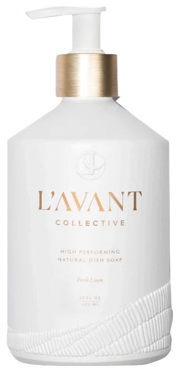 L’Avant Collective’s High Performing Dish Soap, Fresh Linen, comes in a white refillable glass bottle with a pump and gold accents.